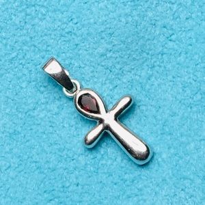 Sterling silver cross with garnet stone